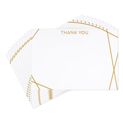 Flat white thank-you cards with intersecting gold foil lines and minimalist “thank you” message.
