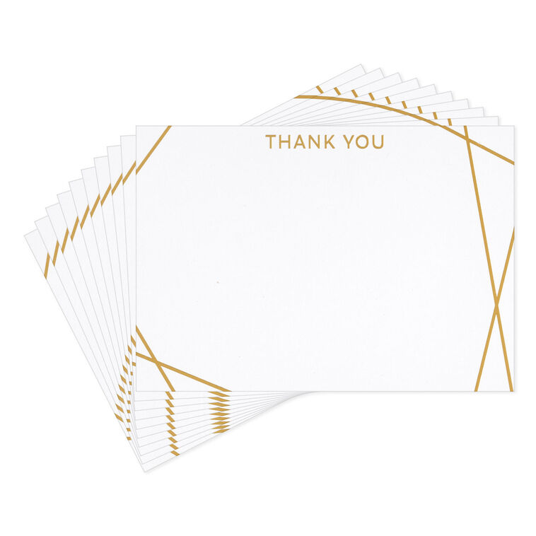 Flat white thank-you cards with intersecting gold foil lines and minimalist “thank you” message.
