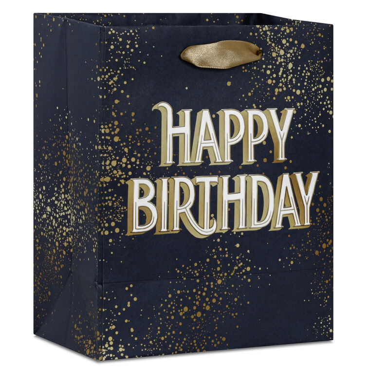 Small Hallmark gift bag with “Happy Birthday” in bold white and gold foil lettering on a navy blue background with gold splatter detail.
