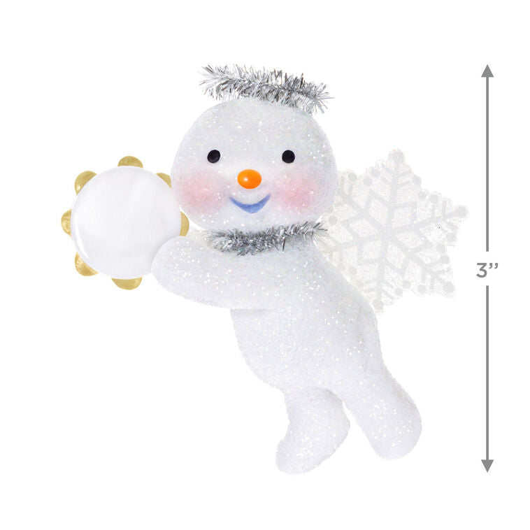 Glittery snow angel snowman ornament with tinsel halo, snowflake wings, rosy cheeks, and holding a tambourine

