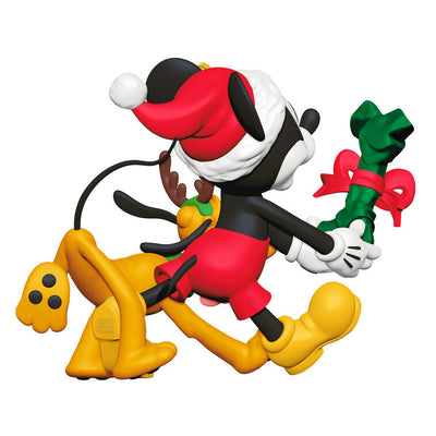 Mickey Mouse holding a dog bone gift walks beside Pluto in reindeer antlers in this cheerful Disney Hallmark Christmas ornament.