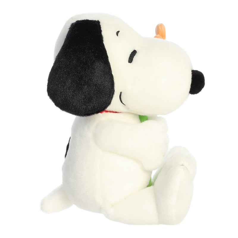 Snoopy plush holding a flower, 11-inch soft black and white stuffed toy from Aurora’s Peanuts collection.