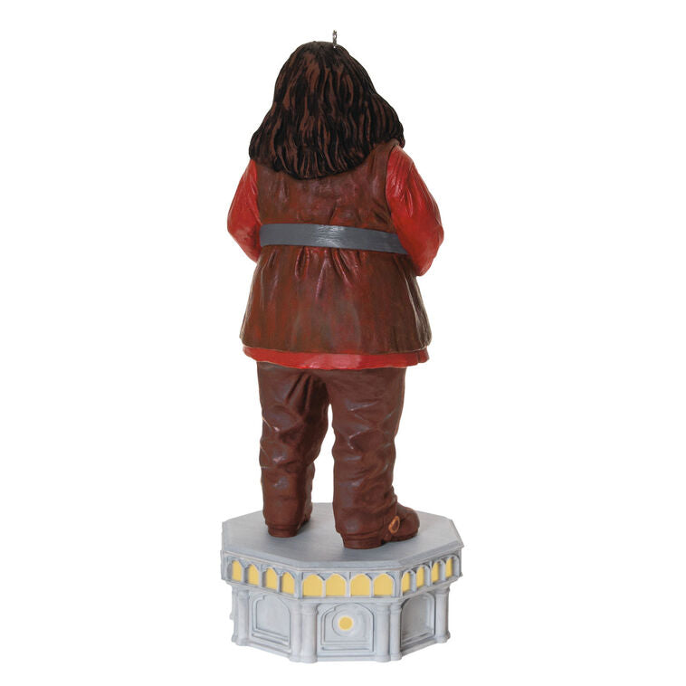 Hallmark Keepsake ornament of Hagrid from Harry Potter, standing on stone base with red coat, light and sound Chamber of Secrets Collection