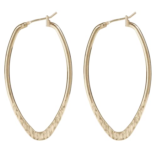 Gold tone hammered oval hoop earrings with sterling silver and 10k gold overlay earwires, handcrafted by Silver Forest.

