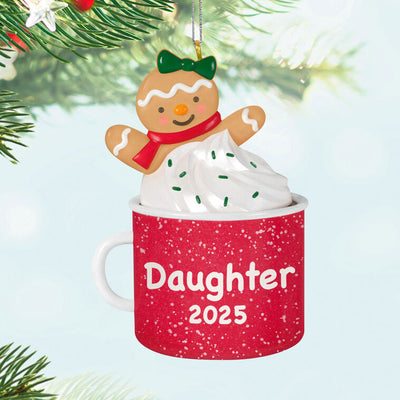 2025 Christmas ornament of gingerbread daughter cookie in red mug with whipped cream, festive holiday design

