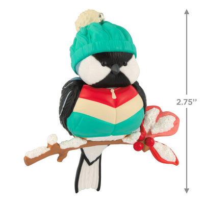 Hallmark Keepsake Cozy Critters ornament—black-capped chickadee in teal stocking hat and striped vest perched on holly branch with glittery snow