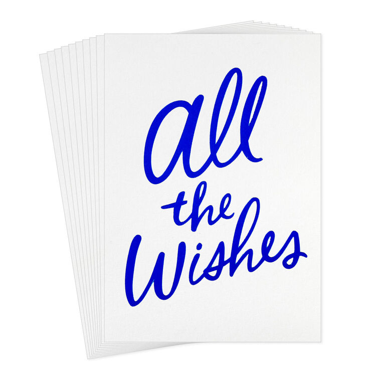 White note cards with vivid blue foil script reading “All the Wishes,” bundled in kraft paper wrap.
