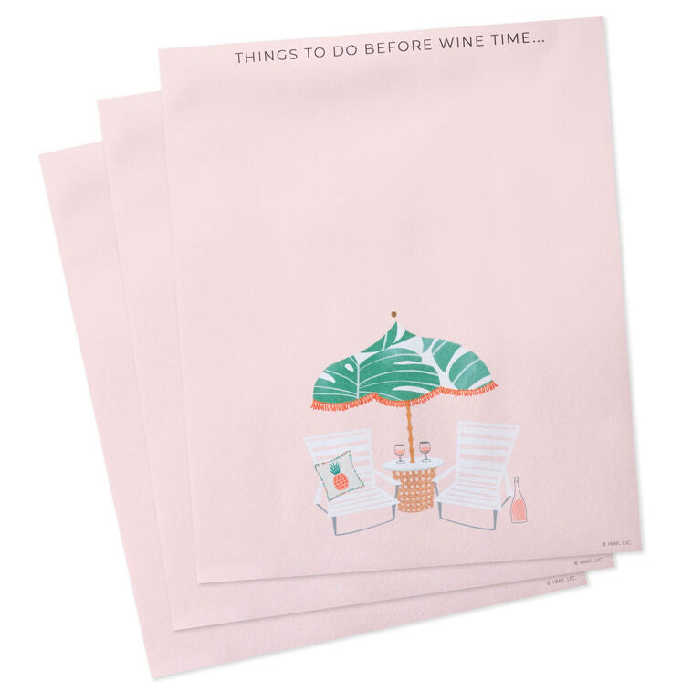 Pink to-do note pad with wine glasses, beach chairs, umbrella, and tropical leaf accents on a striped header.

