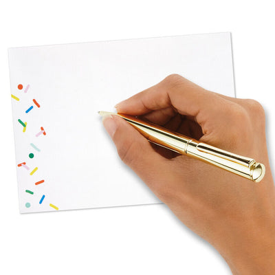 White envelopes with colorful confetti sprinkle design and orange flap interior, perfect for festive notes.
