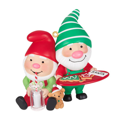 Hallmark Keepsake Gnome for Christmas ornament—two gnomes in red and green hats and overalls, with cookies for Santa and mug of milk, festive scene

