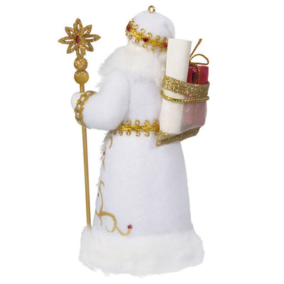 Black Father Christmas ornament in white coat with gold staff, faux-fur trim, and red gem accents.

