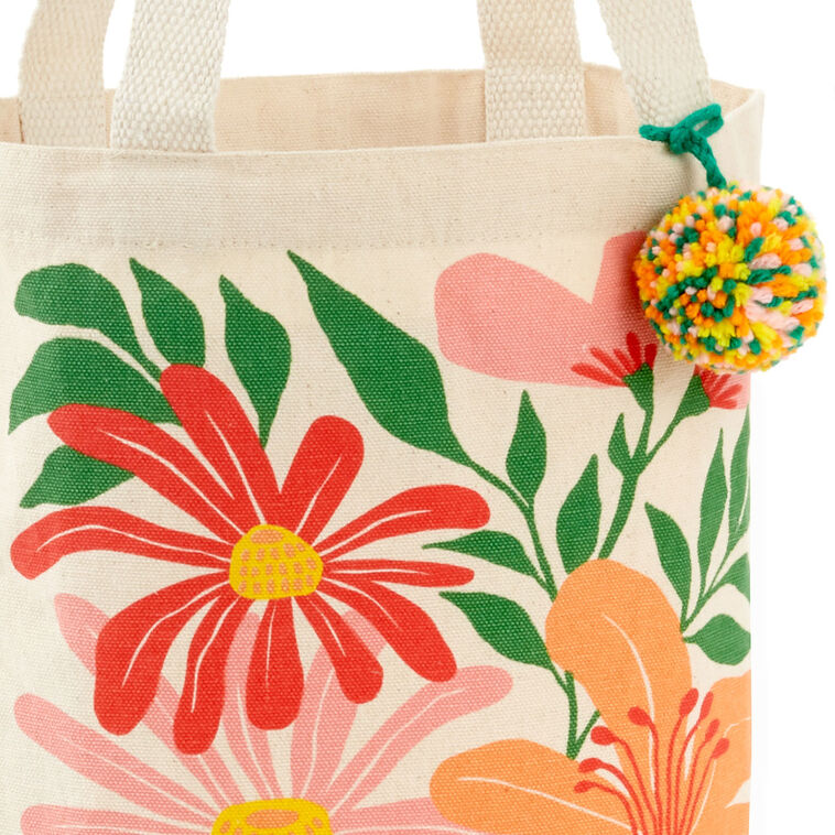 Hallmark 10.5-inch wildflowers fabric gift bag with retro floral design and pom-pom
