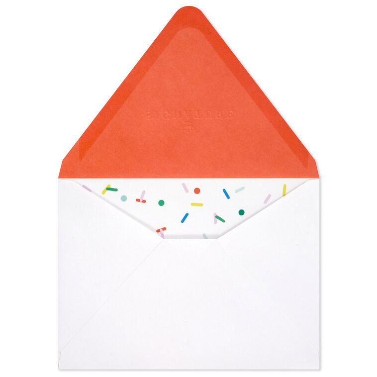 White envelopes with colorful confetti sprinkle design and orange flap interior, perfect for festive notes.
