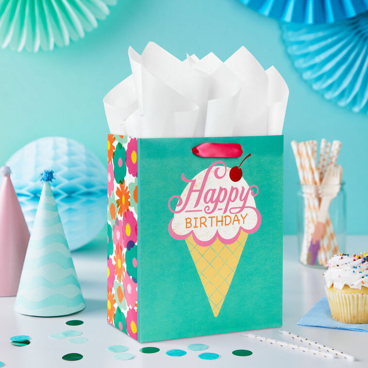 Hallmark birthday gift bag with colorful ice cream cone design, whimsical font, and red foil cherry on green background.