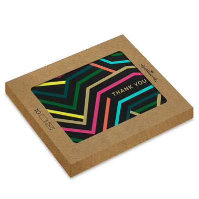 Black thank-you cards with angular neon lines in bold colors and gold foil lettering.
