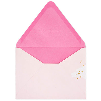 Pink envelopes with white and pink brushstroke flap design and scattered gold foil dot accents, featuring pointed flaps.
