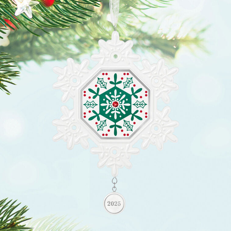 Elegant white porcelain snowflake ornament with red and green accents and red gemstone for 2025