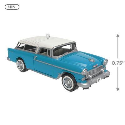 Miniature 1955 Chevrolet Nomad Wagon Christmas ornament in blue and white, featuring vintage styling, turning wheels, and silver accents.