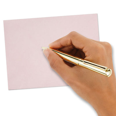 Pink envelopes with white and pink brushstroke flap design and scattered gold foil dot accents, featuring pointed flaps.
