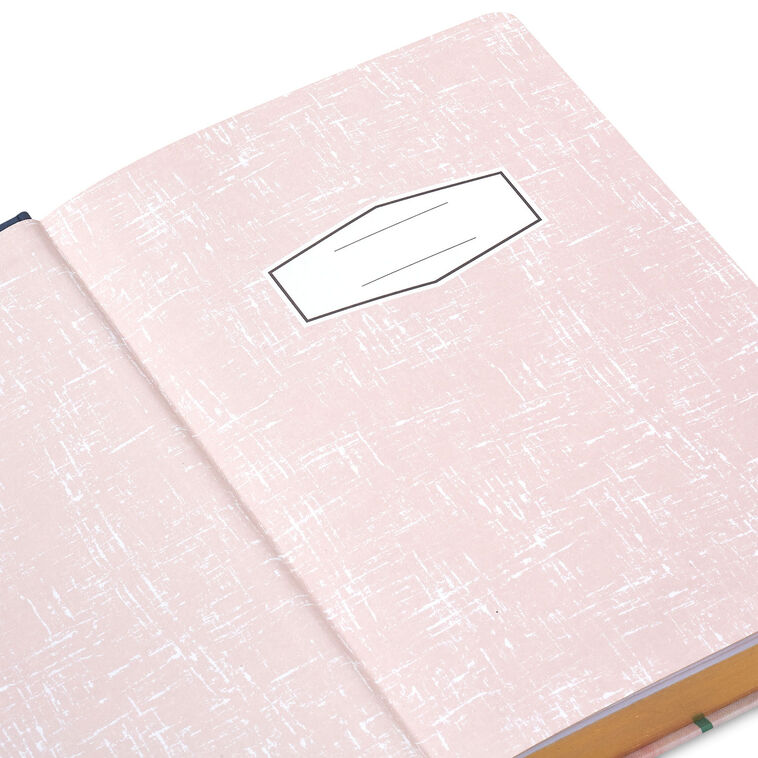 Hardcover journal with purple and pink floral fabric cover, gold-edged pages, and ribbon bookmark.
