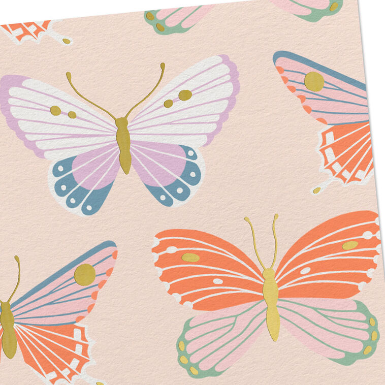 Blank note cards with colorful butterfly illustrations and gold foil accents on a soft peach background.