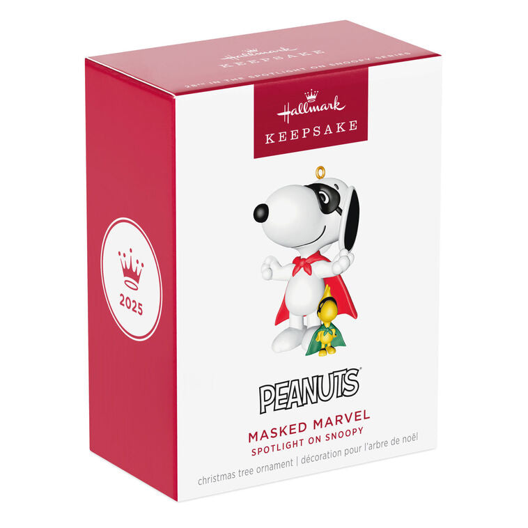 Hallmark Keepsake Peanuts ornament of Snoopy and Woodstock wearing superhero capes and masks, posed as festive holiday heroes.