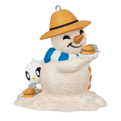 Hallmark Keepsake Sandal the Sandman ornament—sand snowman in Bermuda hat, blue and white scarf, with sub sandwich and sea turtle friend on the beach
