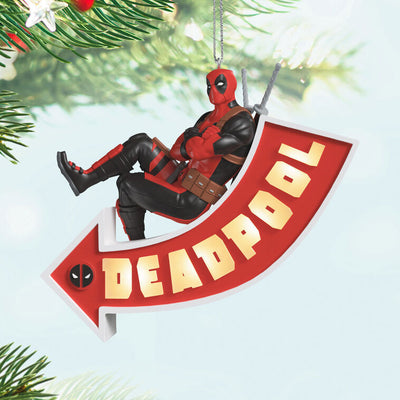 Deadpool ornament, Marvel character in red and black suit, arrow sign marquee, Hallmark Keepsake, Christmas decoration, light-up feature.