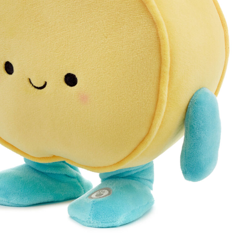 Round yellow smiley face plush toy with blue arms and legs, dancing and singing &