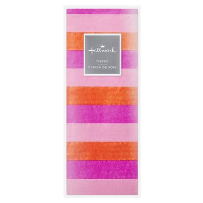 Hallmark tissue paper in horizontal magenta, orange, and pink stripes, styled in flat lay and fluffed in a gift bag for festive presentation