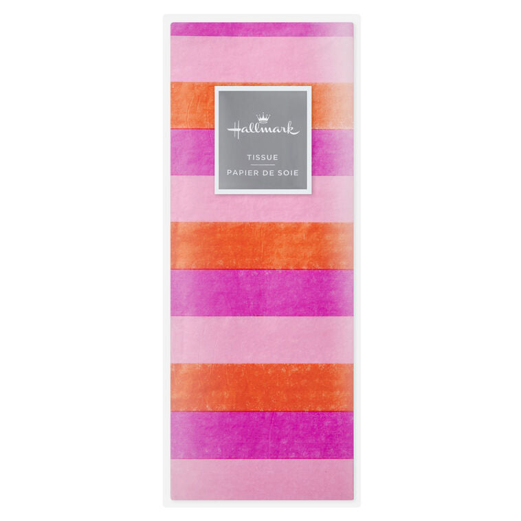 Hallmark tissue paper in horizontal magenta, orange, and pink stripes, styled in flat lay and fluffed in a gift bag for festive presentation