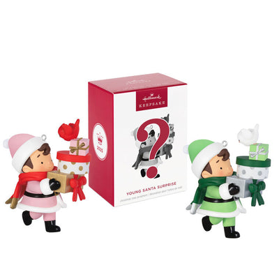 Mystery ornament featuring Young Santa in festive outfit holding presents and a bird, blind-boxed surprise