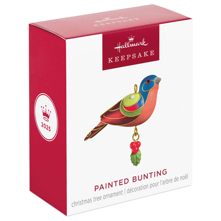 Painted Bunting miniature Christmas tree ornament with colorful feathers, metallic gold trim, and dangling holly berry charm