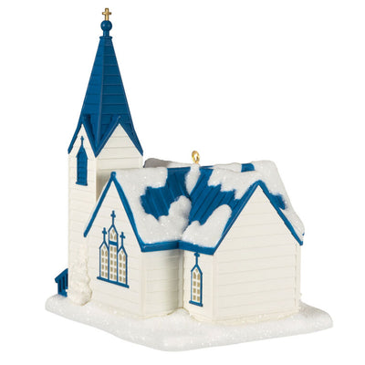 White church ornament with blue roof, steeple, and glowing windows, designed to light up with miniature Christmas light string.