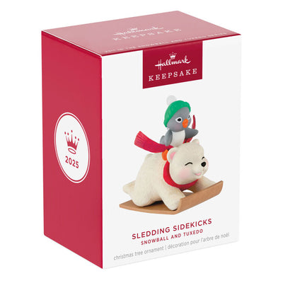 Tuxedo penguin in green hat rides Snowball the polar bear on toboggan, Hallmark Keepsake Christmas ornament