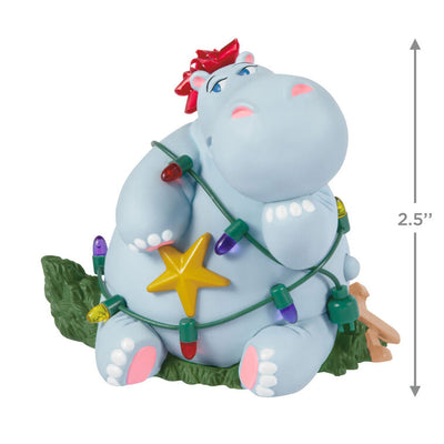 Hippopotamus Christmas ornament tangled in lights on a squished tree, plays holiday song, battery operated

