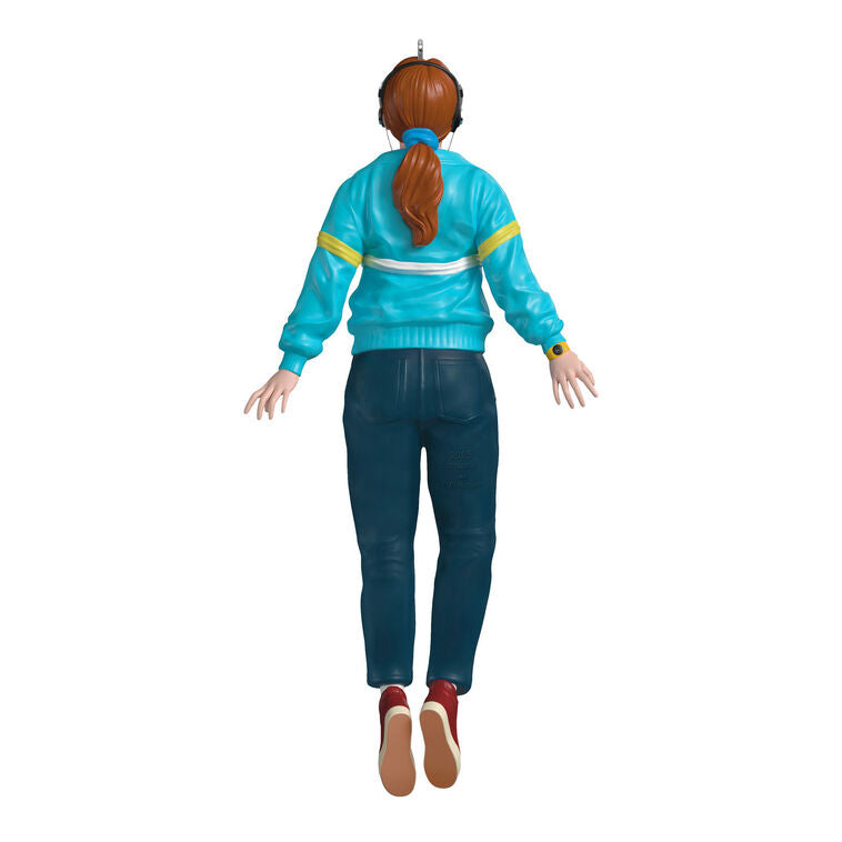 Max Mayfield ornament in blue and yellow windbreaker, levitating with headphones, inspired by Stranger Things TV series.
