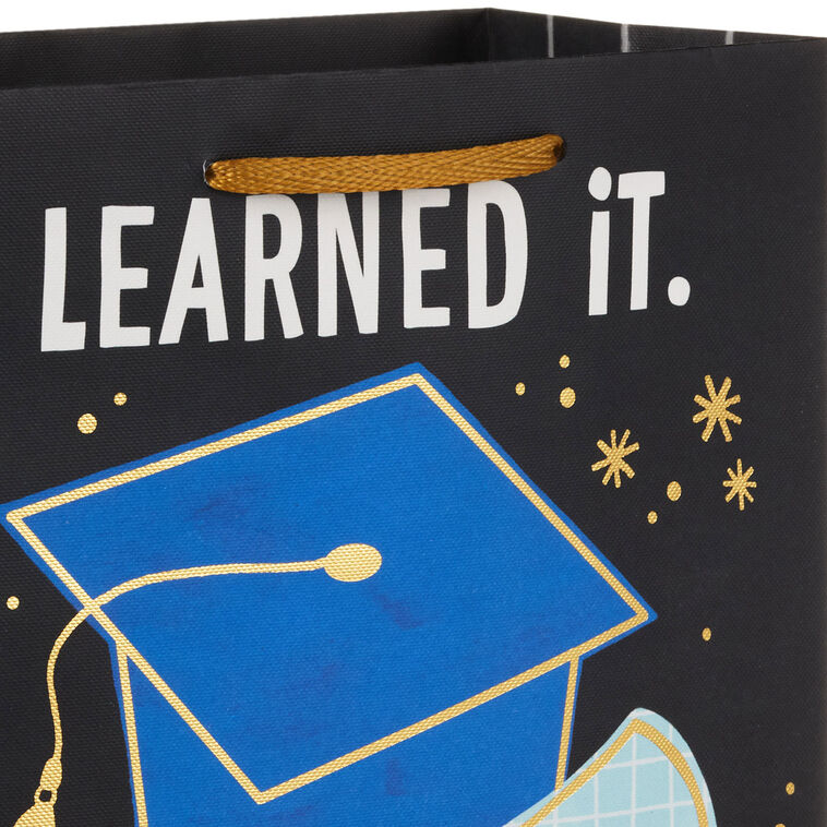 Medium black graduation gift bag with "Learned It. Earned It." and blue mortarboard and diploma, Hallmark, gold foil accents, 9.6 inch size
