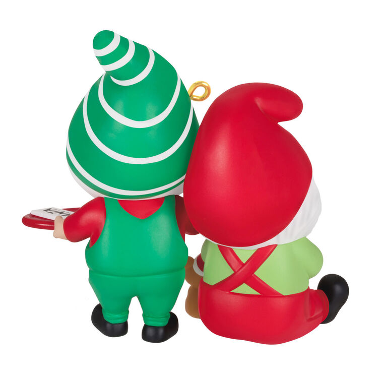 Hallmark Keepsake Gnome for Christmas ornament—two gnomes in red and green hats and overalls, with cookies for Santa and mug of milk, festive scene