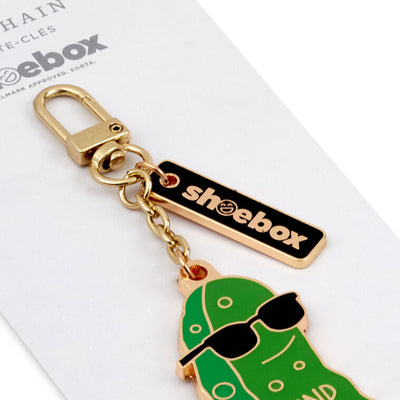 Hallmark pickle keychain with green enamel charm that says “Kind of a Big Dill” in white letters and a black accent tag.