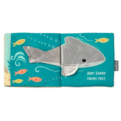 Ocean-themed baby fabric book with sea creature illustrations and tactile features like crinkle paper, squeaker
