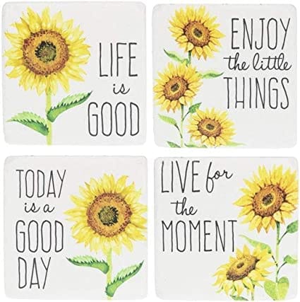 A set of four sunflower-themed resin and cork coasters, each featuring a bright yellow floral design.