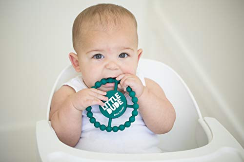 Round silicone baby teether with "Little Dude" printed on it, textured for teething relief, and easy for small hands to grip.