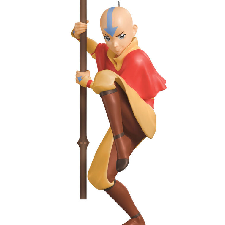 Christmas ornament of Aang from Avatar: The Last Airbender holding his staff in a defensive pose with arrow tattoo on forehead.