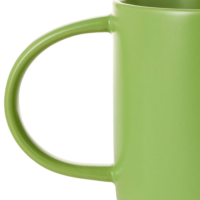 Bright green ceramic mug with white lettering that reads “At least one person in this family has their sh!t together
