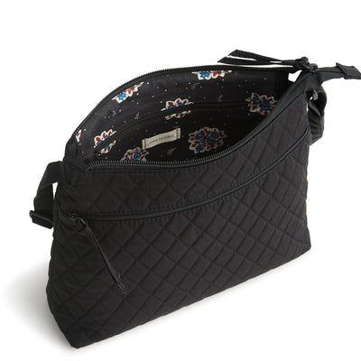 Vera Bradley Original Zip Hipster in Moonless Night black, sleek crossbody with three zippered compartments, adjustable strap, and hands-free design for everyday travel.
