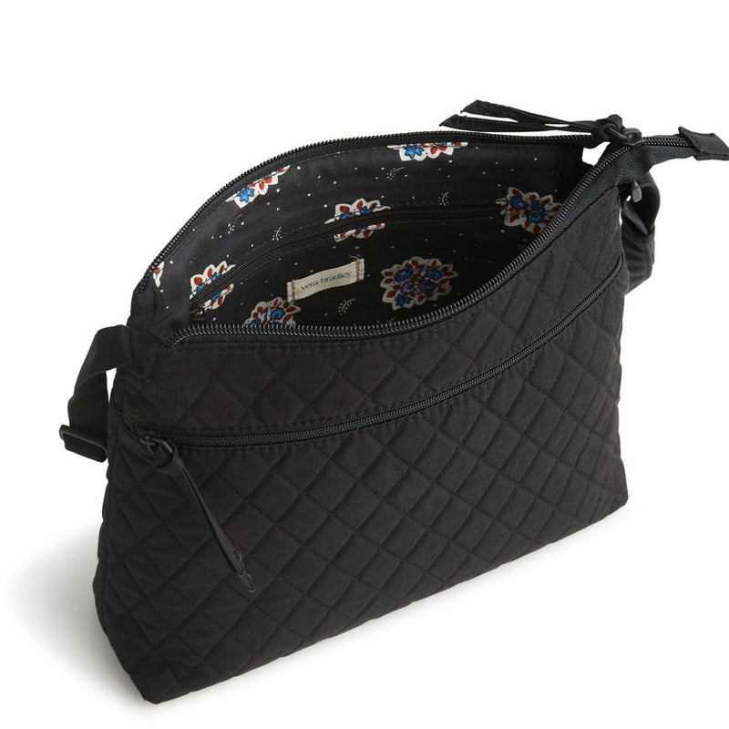 Vera Bradley Original Zip Hipster in Moonless Night black, sleek crossbody with three zippered compartments, adjustable strap, and hands-free design for everyday travel.
