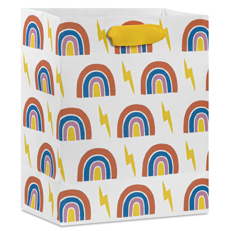 Small Hallmark gift bag with colorful rainbows and yellow lightning bolts on a white background with yellow ribbon handles.