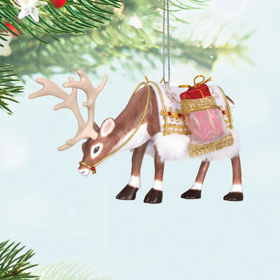 Hallmark Keepsake ornament of a regal reindeer with a festive saddle blanket, faux fur, gold trim, and a present, 2025 Keepsake Premiere.