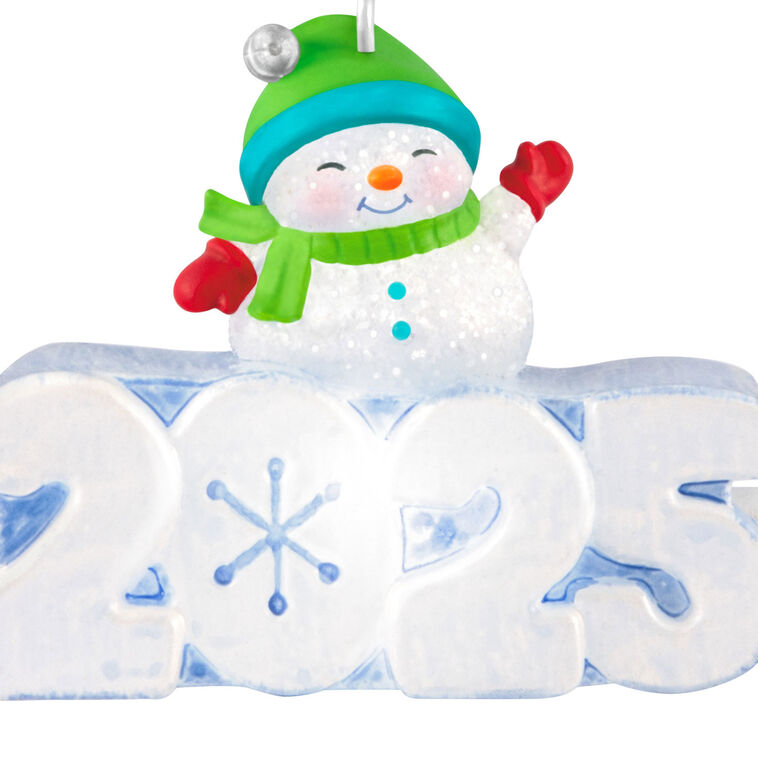 Glittery snowman in green hat and scarf atop snow-sculpted 2025, light-up mini Hallmark Christmas ornament, holiday collectible

